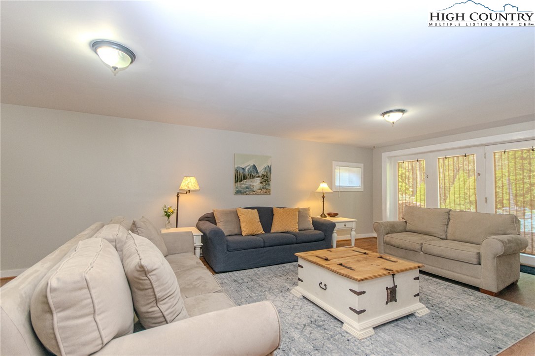 1268 Pine Run Road Boone, NC 28607 - Photo 28 of 48 a living room with furniture and a large window