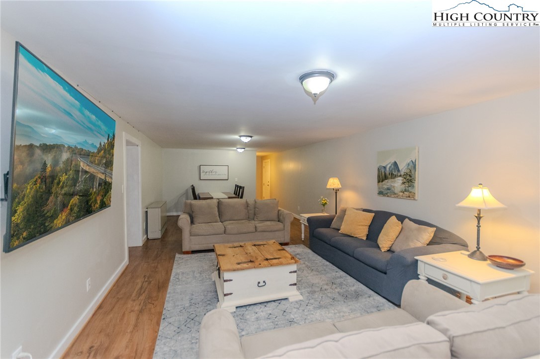 1268 Pine Run Road Boone, NC 28607 - Photo 30 of 48 a living room with furniture and a lamp