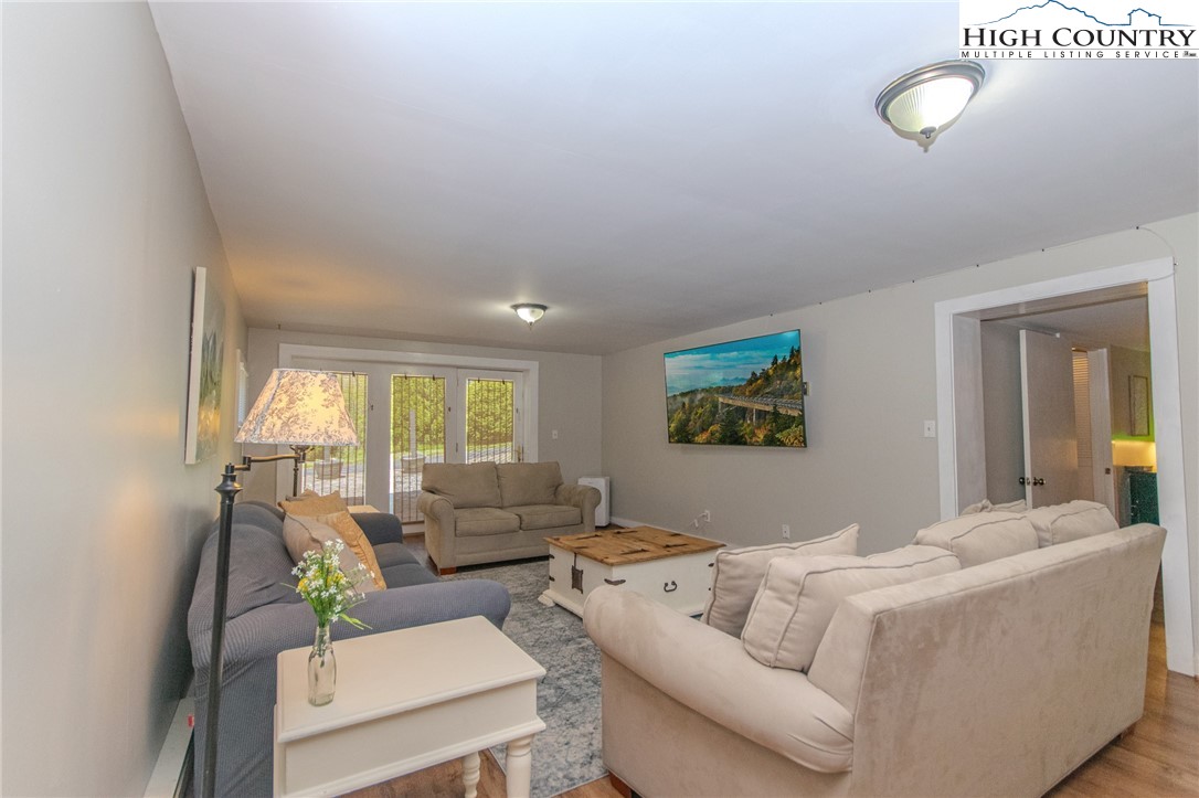 1268 Pine Run Road Boone, NC 28607 - Photo 31 of 48 a living room with furniture and a large window