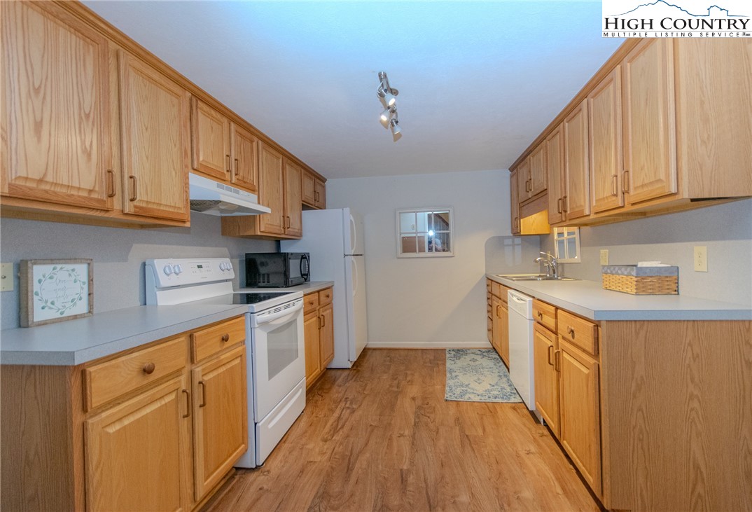 1268 Pine Run Road Boone, NC 28607 - Photo 35 of 48 a kitchen with stainless steel appliances granite countertop a sink and cabinets