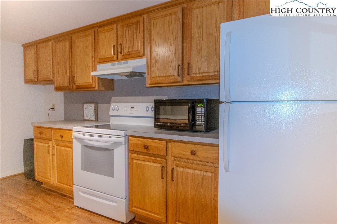1268 Pine Run Road Boone, NC 28607 - Photo 36 of 48 a kitchen with stainless steel appliances granite countertop a refrigerator a stove a sink and dishwasher