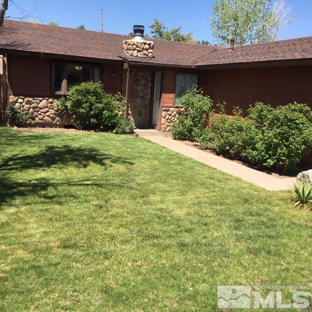 14060 Perlite Drive Reno, NV 89521 - Photo 1 of 15 a view of a house with a yard and potted plants