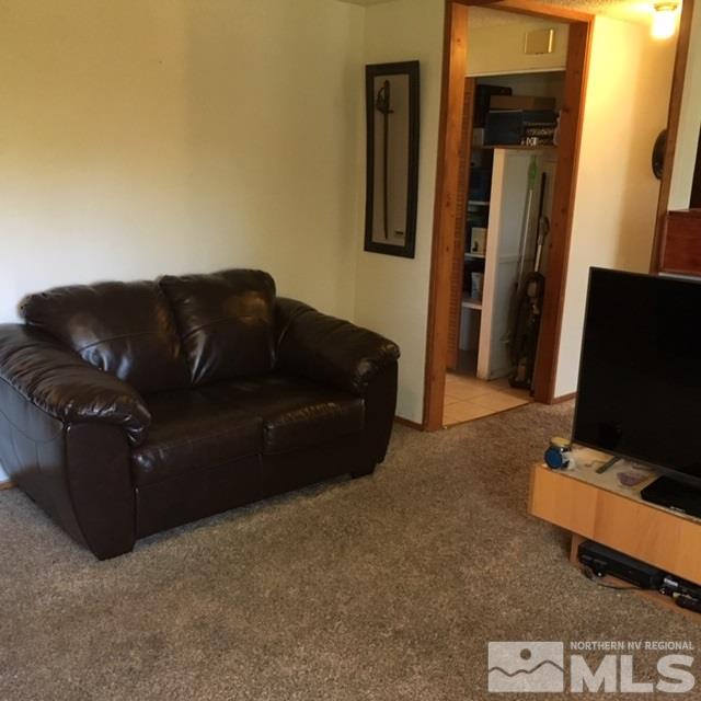 14060 Perlite Drive Reno, NV 89521 - Photo 13 of 15 a living room with furniture and a flat screen tv