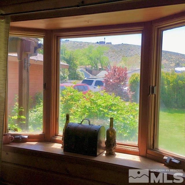 14060 Perlite Drive Reno, NV 89521 - Photo 14 of 15 a room with wooden floor and a window