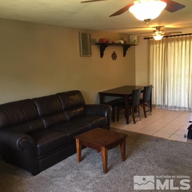 14060 Perlite Drive Reno, NV 89521 - Photo 4 of 15 a living room with furniture a dining table and a window