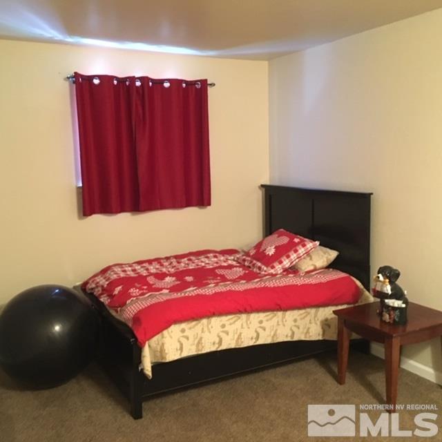14060 Perlite Drive Reno, NV 89521 - Photo 8 of 15 a bedroom with a bed and a closet