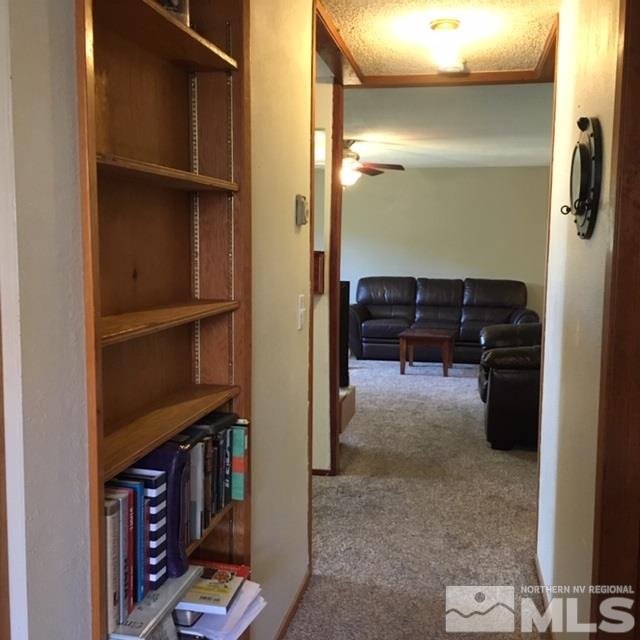 14060 Perlite Drive Reno, NV 89521 - Photo 9 of 15 a view of living room with furniture and wooden floor