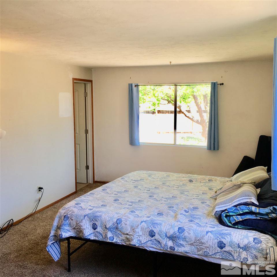 14060 Perlite Drive Reno, NV 89521 - Photo 10 of 15 a bedroom with a bed and a window