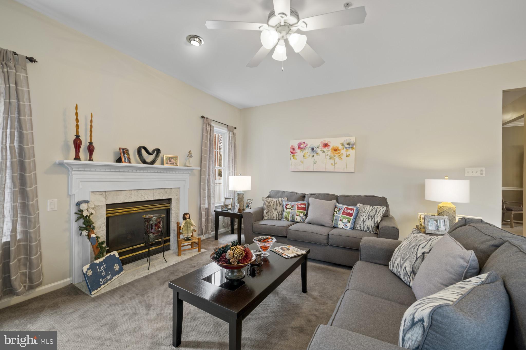 211 South Norwinden Drive Springfield, PA 19064 - Photo 17 of 38 a living room with furniture and a fireplace