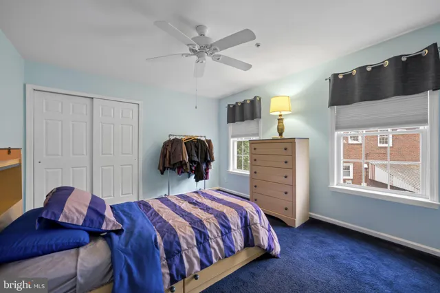 a bed room with a bed and a window