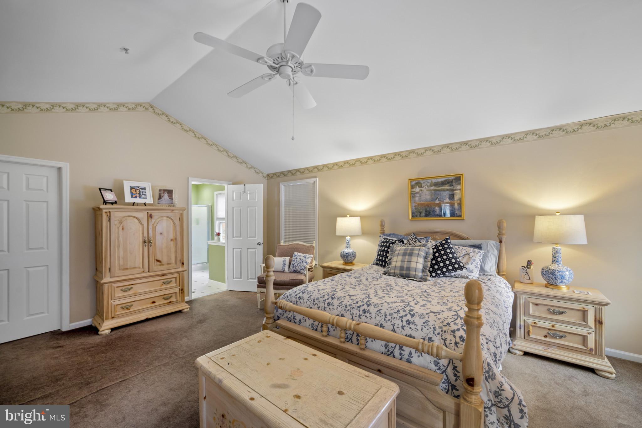 211 South Norwinden Drive Springfield, PA 19064 - Photo 28 of 38 a bedroom with a bed and a chandelier