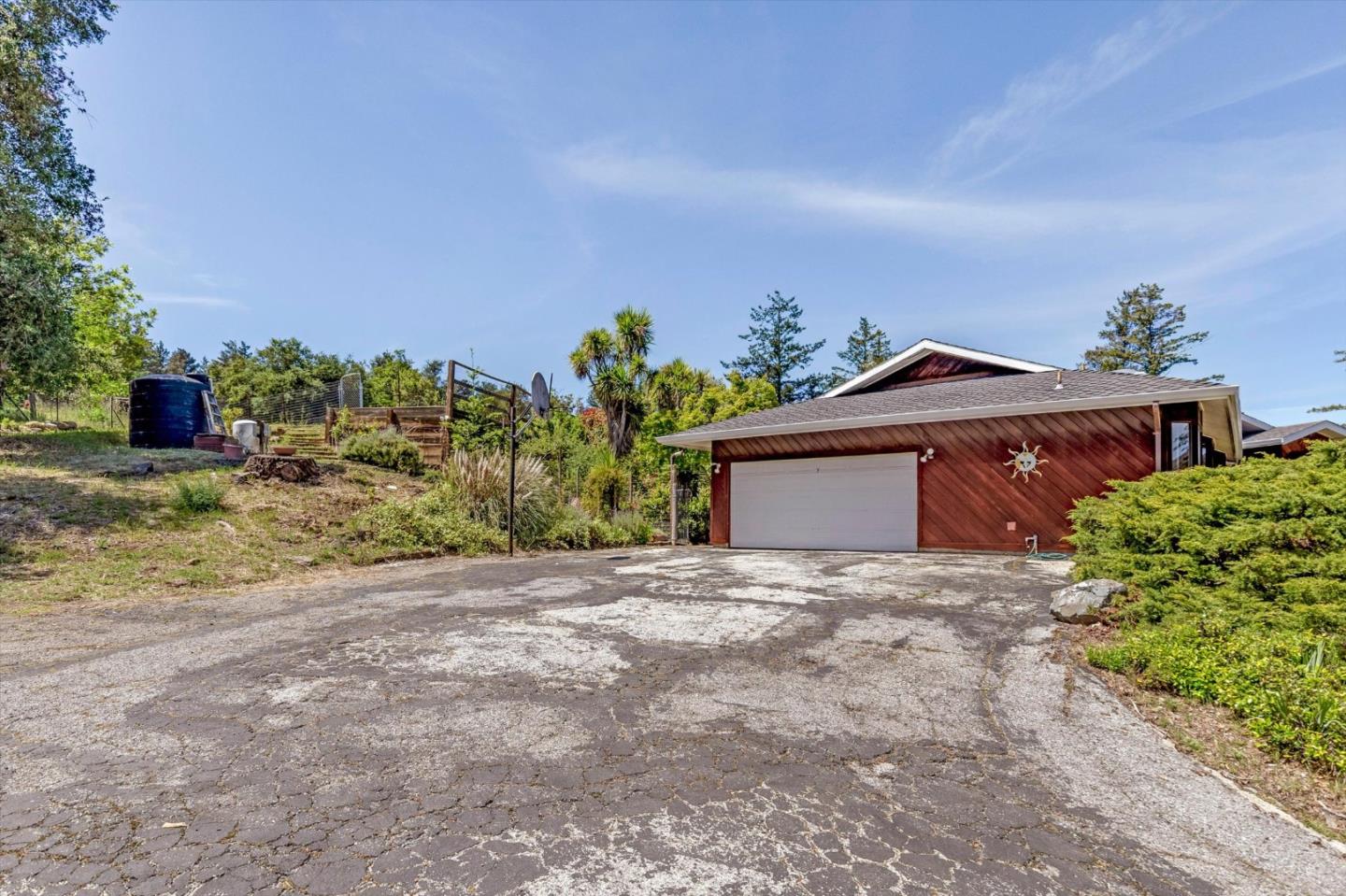 25149 Radonich Road Los Gatos, CA 95033 - Photo 39 of 47 a view of a house with a yard and a garage