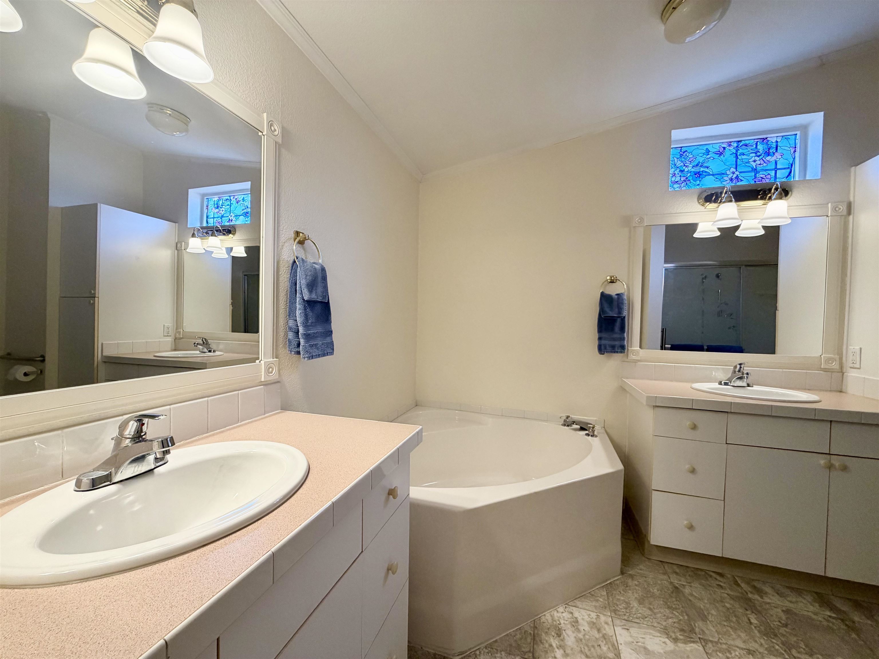 435 32 Road, Unit 480 Clifton, CO 81520 - Photo 13 of 23 a bathroom with a tub sink and mirror