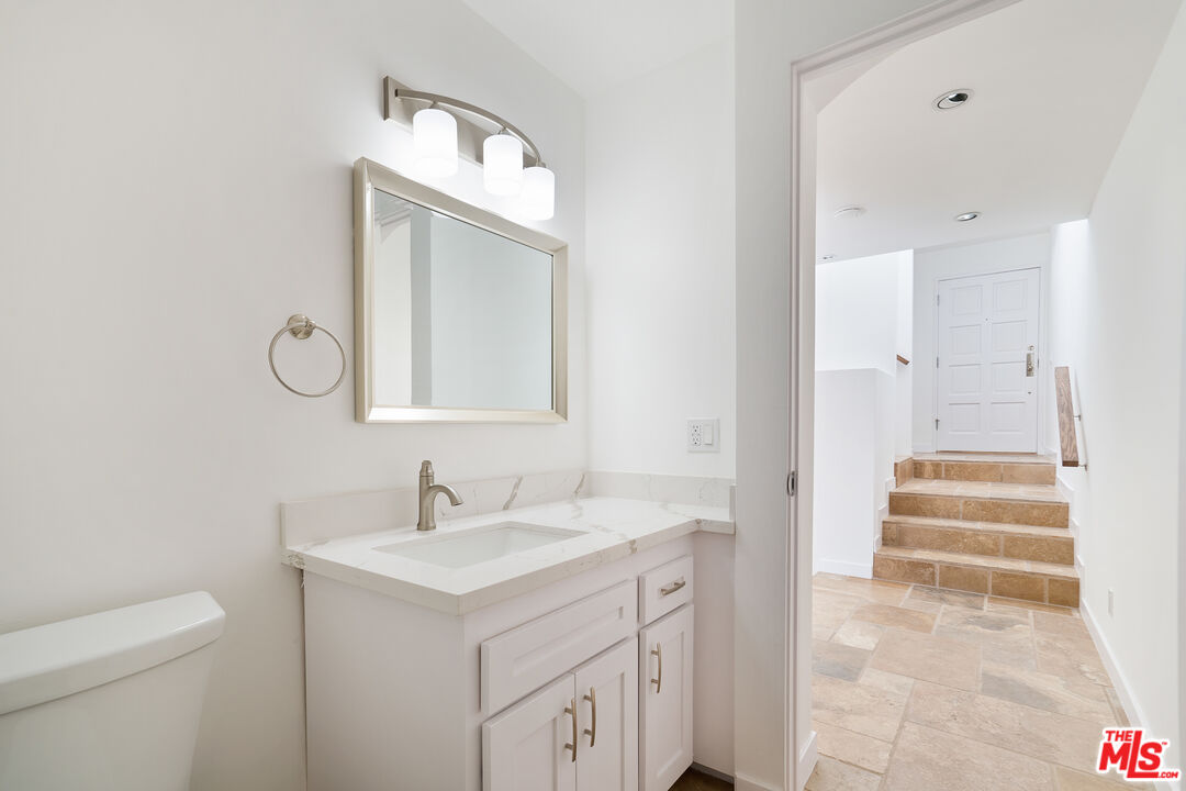 31246 Bailard Road Malibu, CA 90265 - Photo 12 of 31 a bathroom with a sink and a mirror