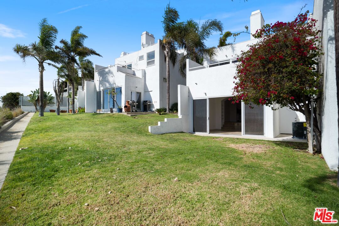 31246 Bailard Road Malibu, CA 90265 - Photo 16 of 31 a front view of a house with a garden and trees