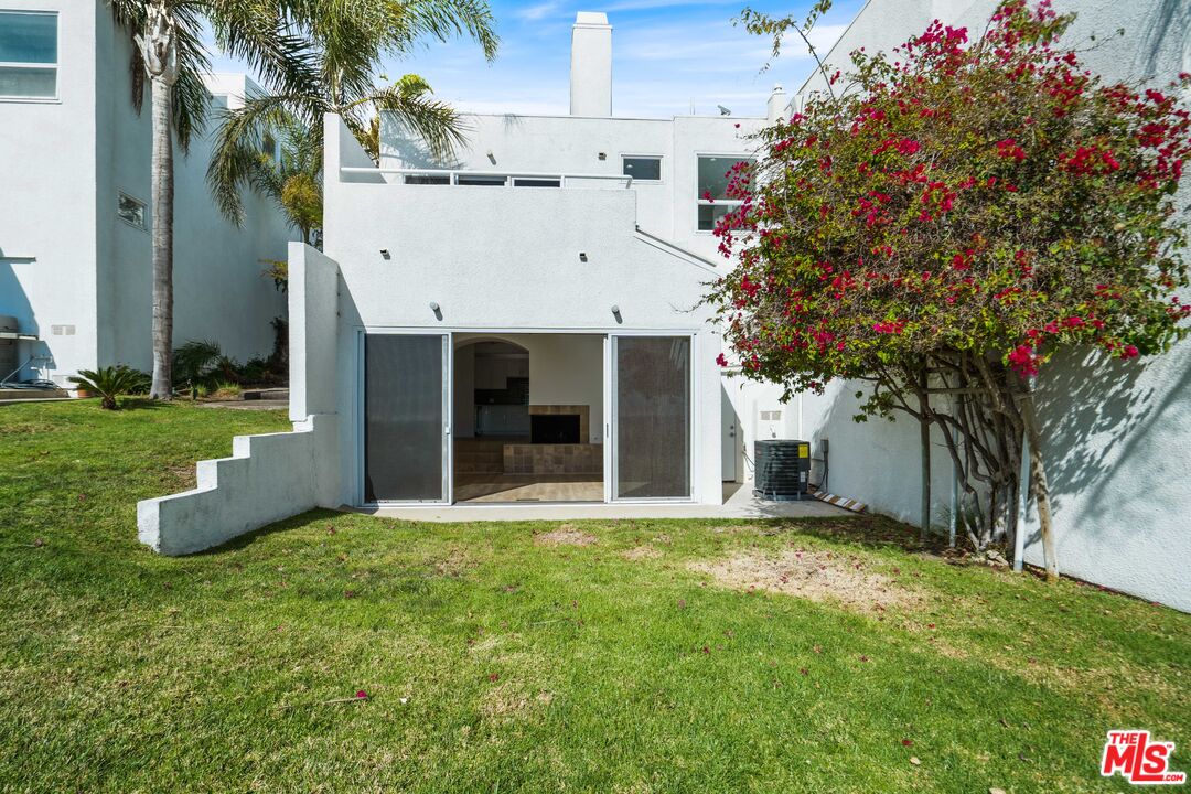 31246 Bailard Road Malibu, CA 90265 - Photo 17 of 31 a view of a white house with a large tree and a yard