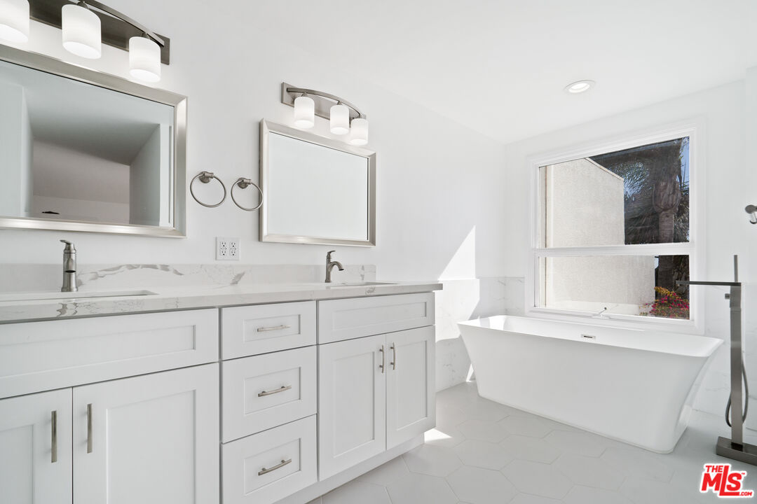 31246 Bailard Road Malibu, CA 90265 - Photo 23 of 31 a bathroom with a double vanity sink mirror and