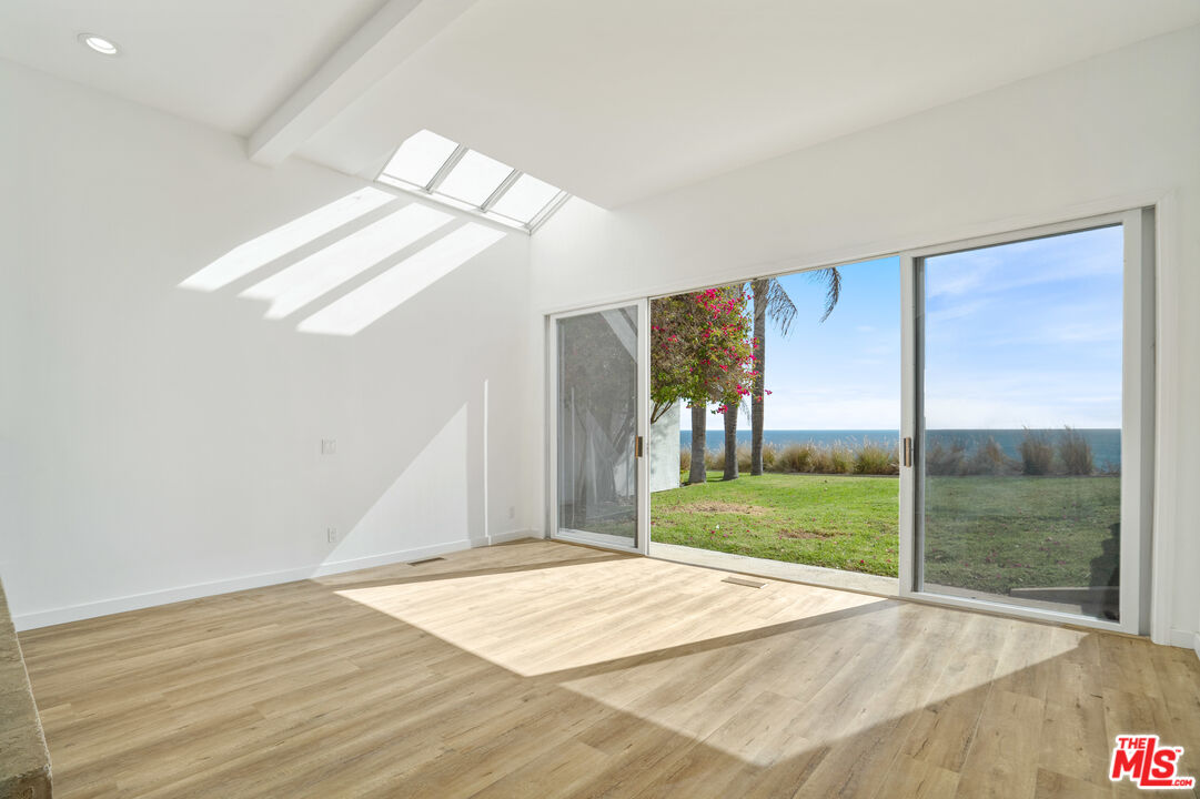 31246 Bailard Road Malibu, CA 90265 - Photo 9 of 31 a view of empty room with wooden floor and fan