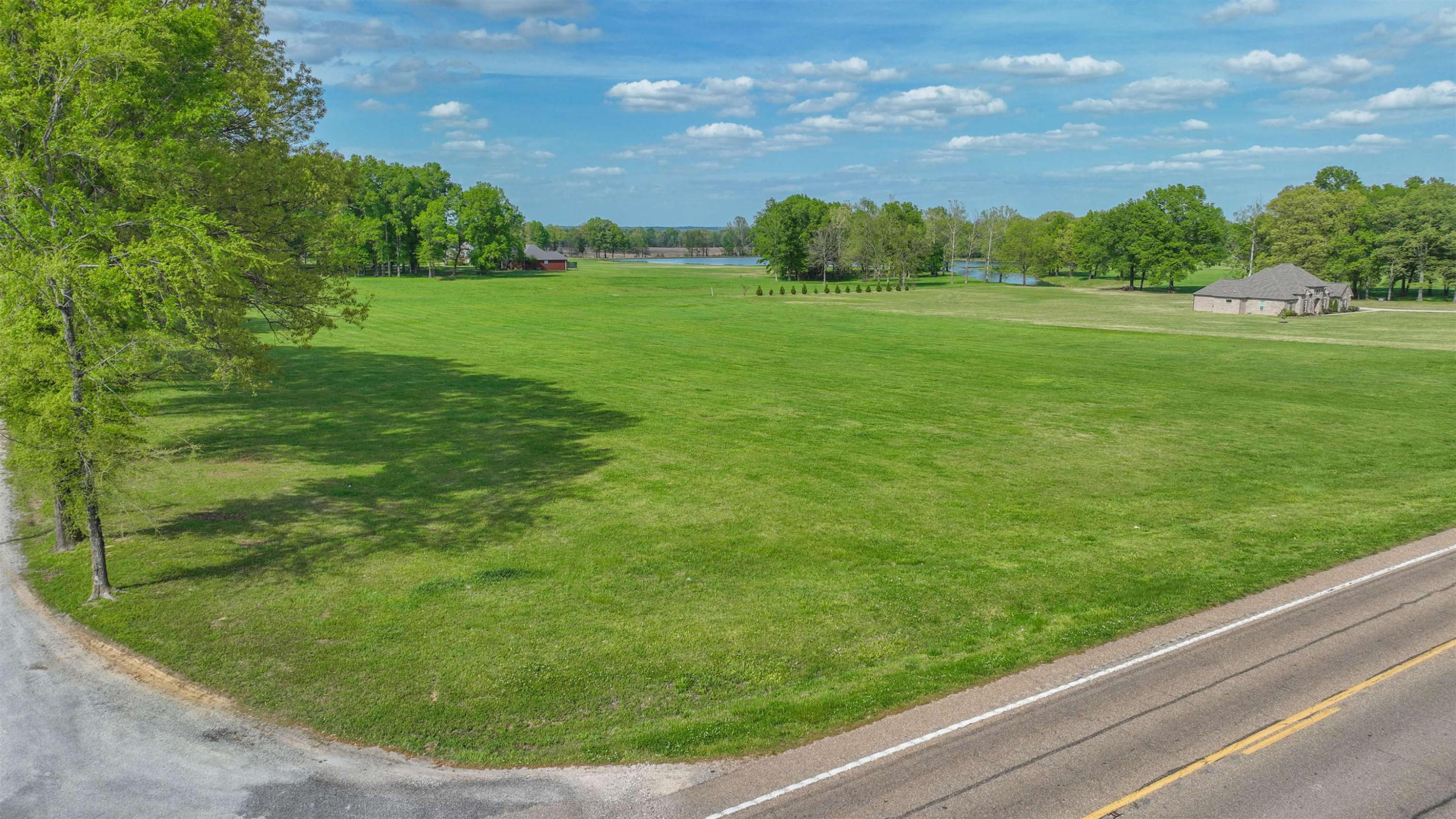 0 Valentine Road Jackson, TN 38301 - Photo 6 of 8 a view of a field with an trees