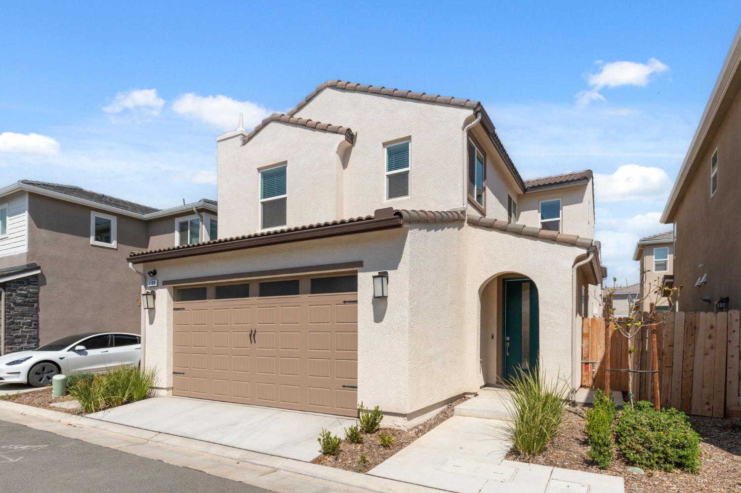 1109 Royalty Way West Madera, CA 93636 - Photo 1 of 47 a view of a white house with large windows and palm tree