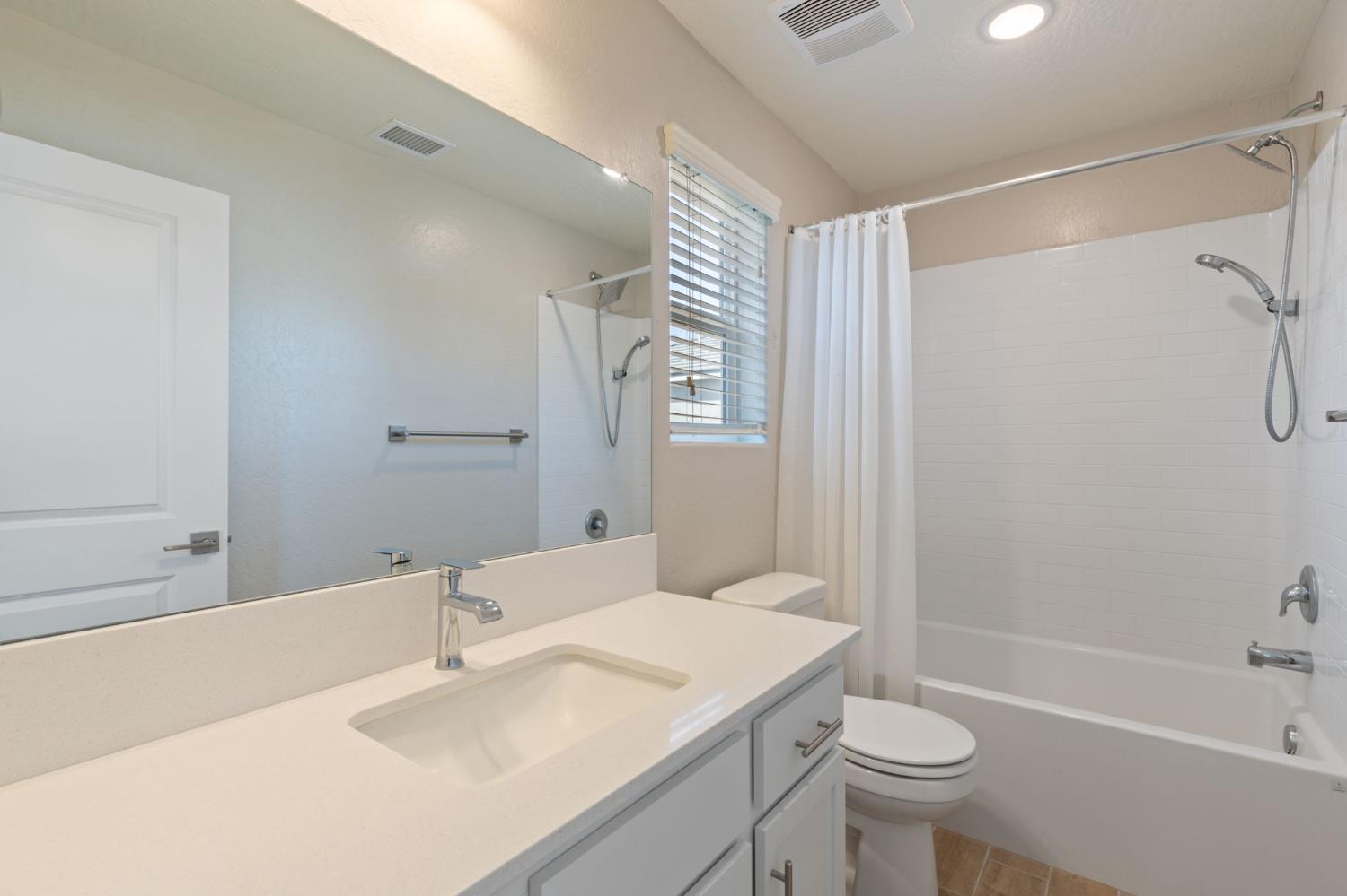 1109 Royalty Way West Madera, CA 93636 - Photo 19 of 47 a bathroom with a sink toilet vanity and shower