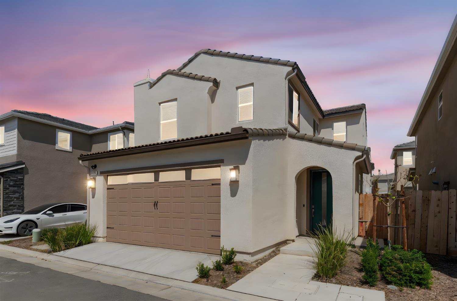 1109 Royalty Way West Madera, CA 93636 - Photo 2 of 47 a front view of a house with garage and plants