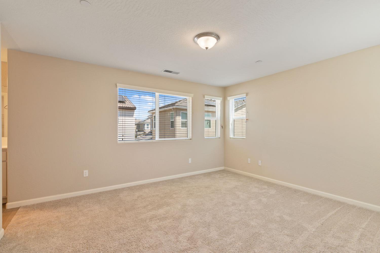 1109 Royalty Way West Madera, CA 93636 - Photo 21 of 47 a view of an empty room with a window