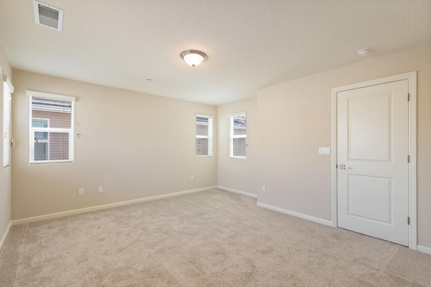1109 Royalty Way West Madera, CA 93636 - Photo 23 of 47 an empty room with windows