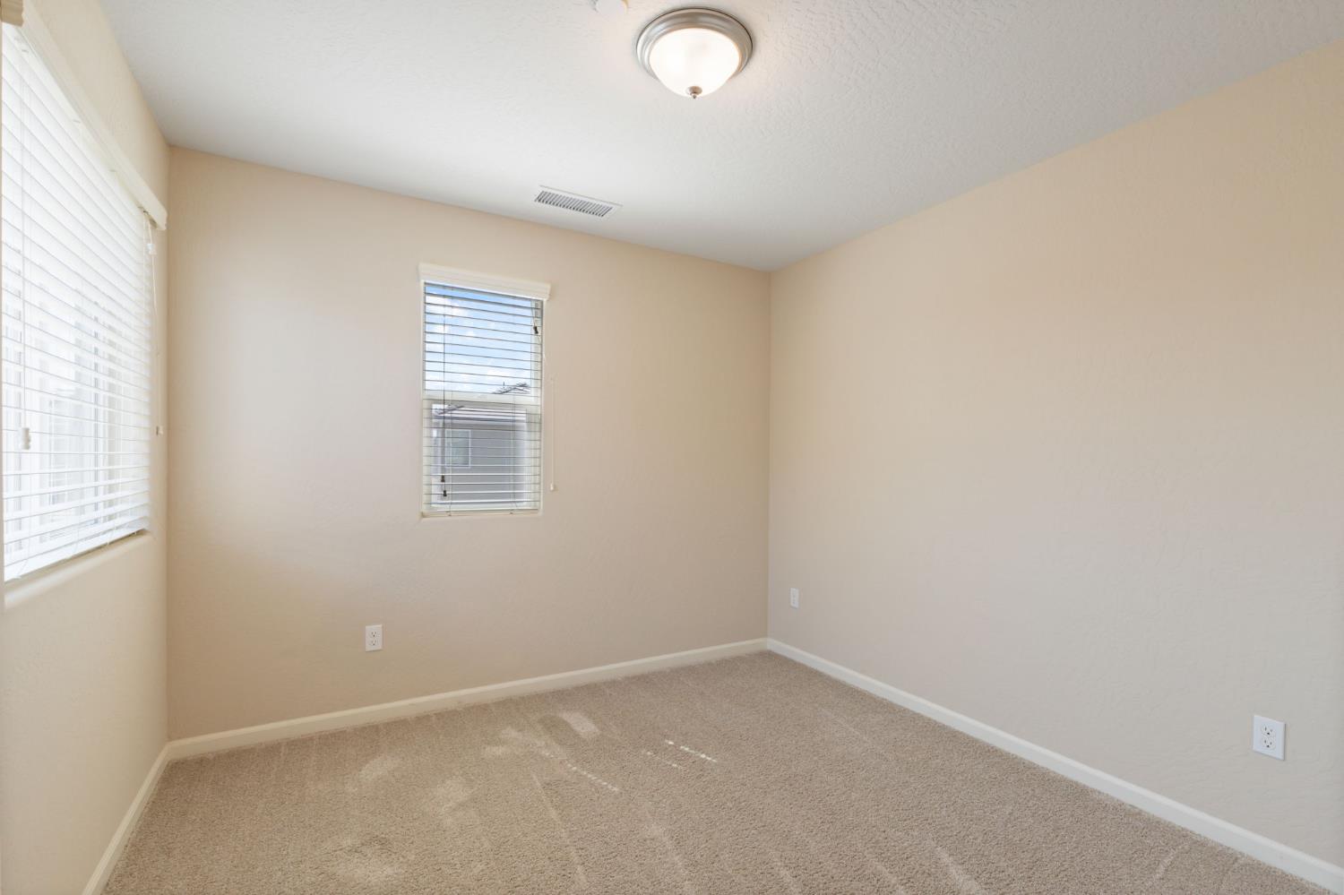 1109 Royalty Way West Madera, CA 93636 - Photo 26 of 47 an empty room with a window