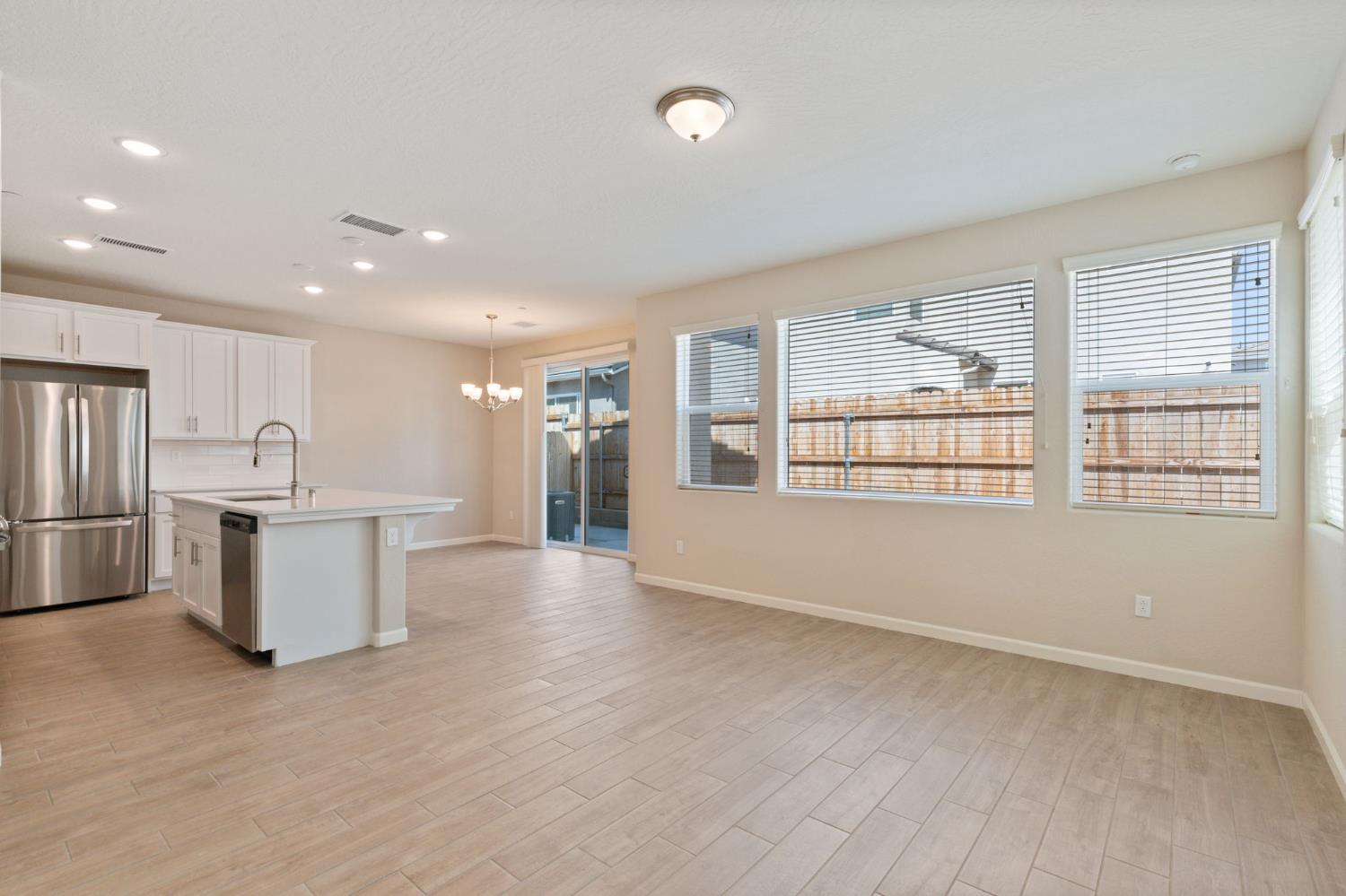 1109 Royalty Way West Madera, CA 93636 - Photo 7 of 47 a view of a kitchen with a sink and refrigerator