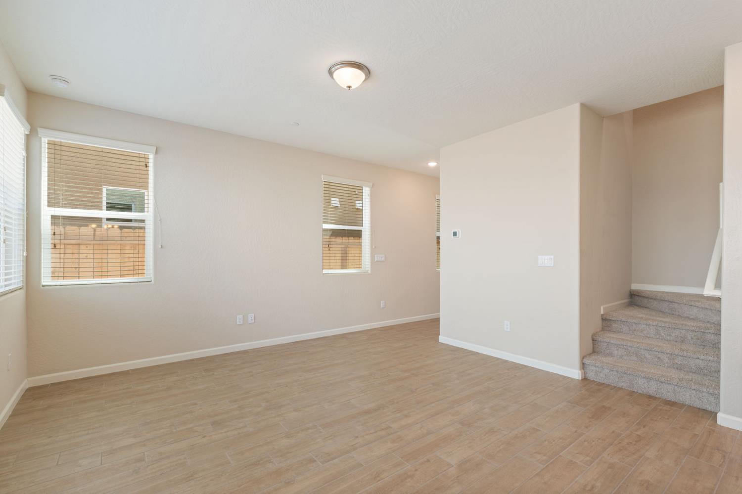 1109 Royalty Way West Madera, CA 93636 - Photo 8 of 47 a view of an empty room with closet and a window