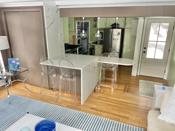 a white toilet sitting next to a bathroom sink