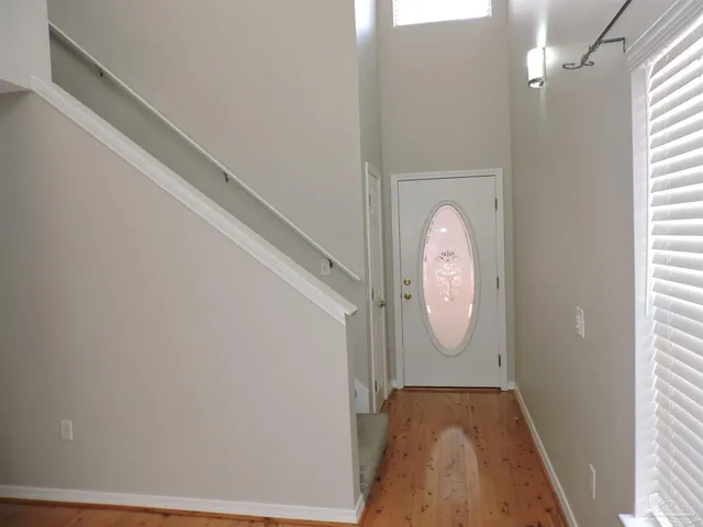 a view of a hallway with windows