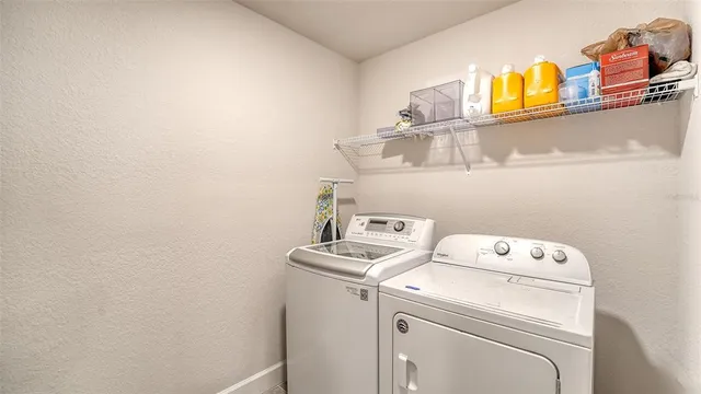 a bedroom with baby bed toys and a window