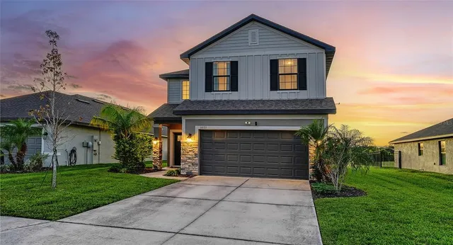 a view of swimming pool with outdoor seating and garden