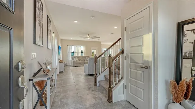 a view of an entryway with staircase and interior