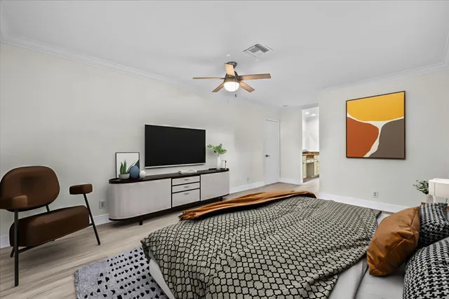 a close view of a granite countertop sink a mirror and a shower