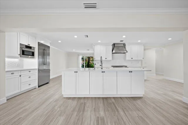 an aerial view of a house with a yard and garden