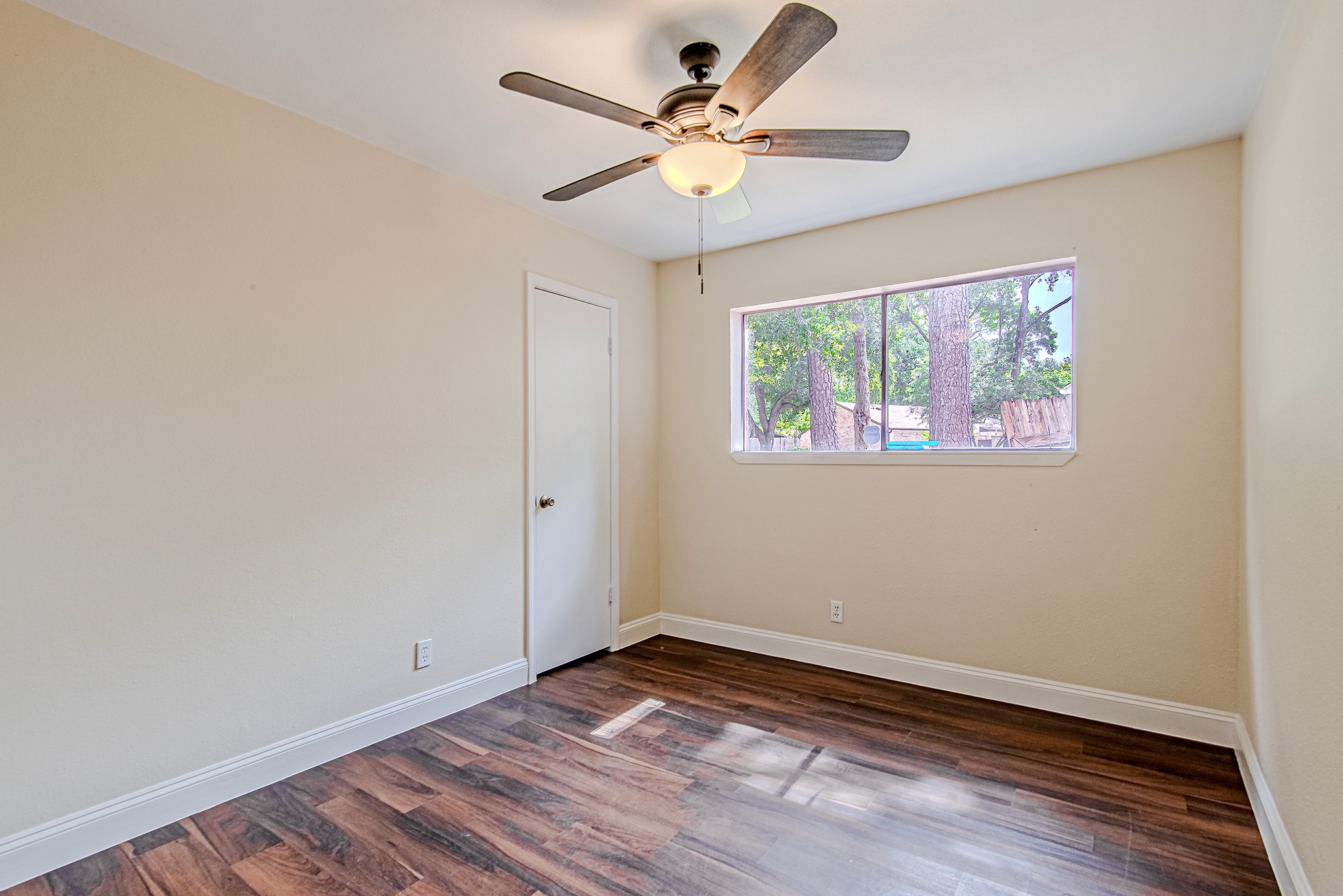 17811 Hawk Haven Lane Spring, TX 77379 - Photo 17 of 22 Cozy bedroom with warm flooring tones and natural light.
