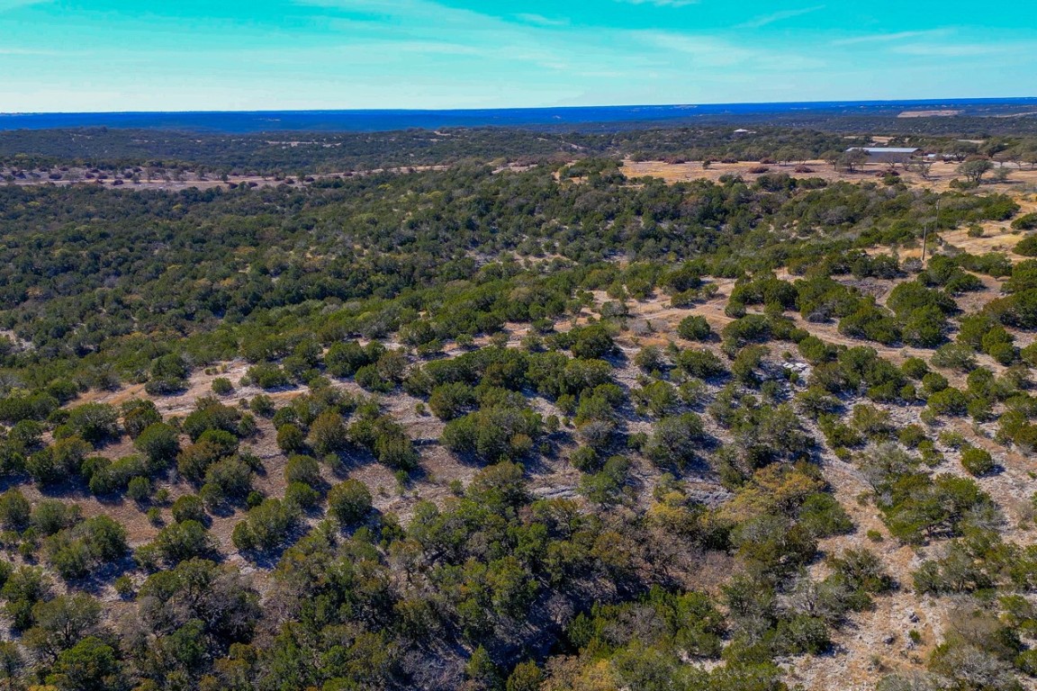 Undisclosed Address Rocksprings, TX 78880 - Photo 9 of 11 Aerial overview of property's location with a heavily wooded area