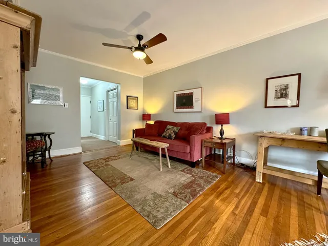 a living room with furniture and a rug