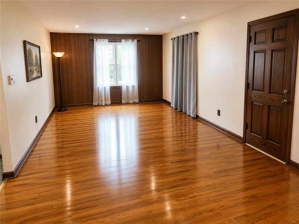 2836 Nazareth Road Easton, PA 18045 - Photo 6 of 19 Refined wood paneling and shining hardwood floors enhance this versatile living space.