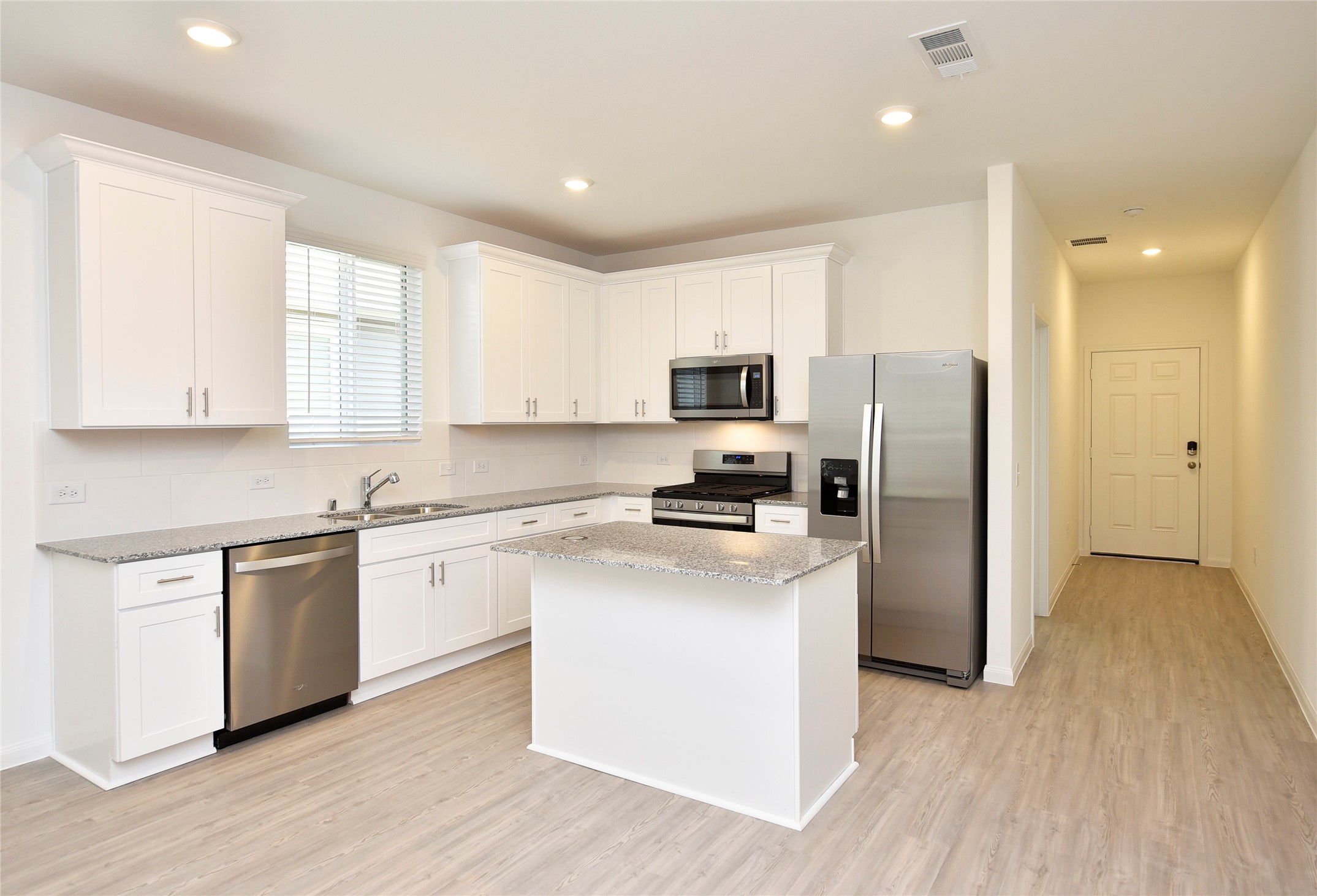 25473 Cilantro Drive Magnolia, TX 77355 - Photo 6 of 21 You’re going to fall in love with this open, bright kitchen—complete with a central island and recessed lighting.