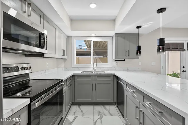 a room with a wooden floor and white walls