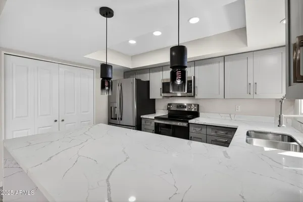 a kitchen with a sink and cabinets