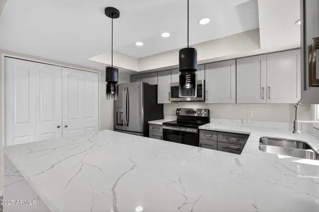 a kitchen with a sink and cabinets