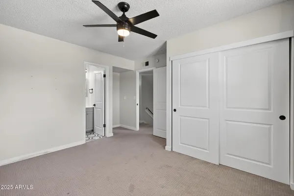 a white toilet sitting next to a bathroom sink