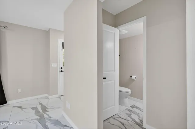 a view of a bathroom with toilet