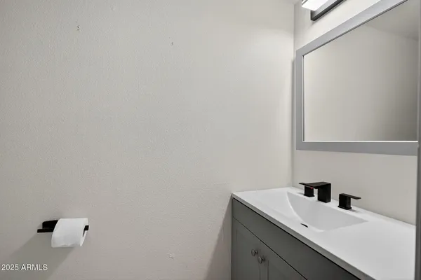 a bathroom with a sink and vanity
