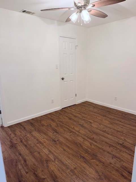 2500 Burleson Road, Unit 713 Austin, TX 78741 - Photo 11 of 15 Hardwood-style flooring and a ceiling fan create a comfortable and inviting atmosphere in this bedroom.